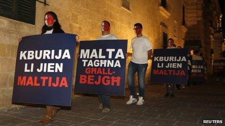 Protesters in Malta opposing new citizenship scheme, 12 Nov 13