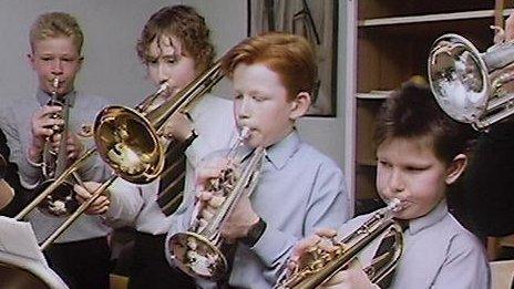 Schoolboys playing brass