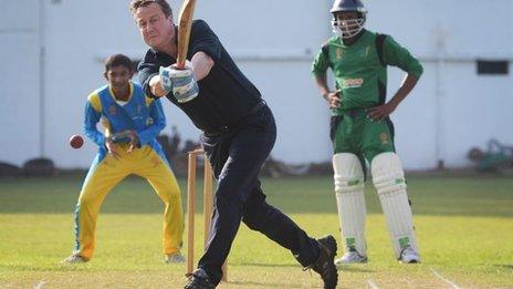 UK Prime Minister David Cameron playing cricket in Sri Lanka, 16 November 2013