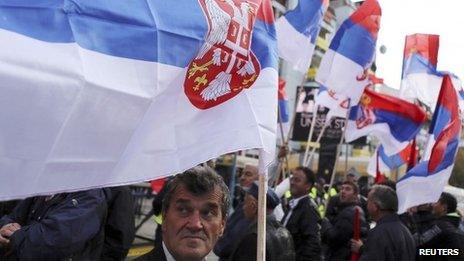 People wave Serbian flags during a rally in Mitrovica. Photo: 15 November 2013