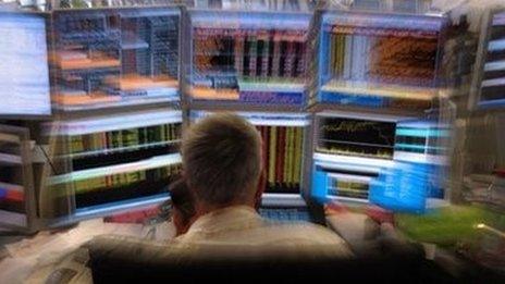 trader in front of screen