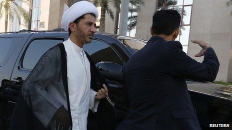 Ali Salman arrives at a police station in Bahrain for questioning (3 November 2013)