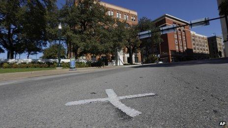 An 'X' mark seen on Elm Street in Dallas, Texas on 12 November indicates where US President John F Kennedy was shot on 22 November 1963