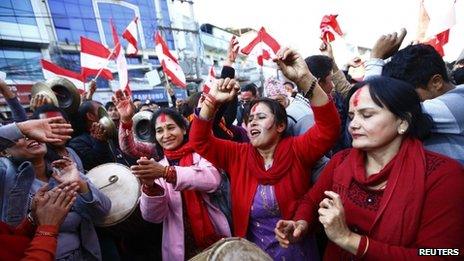 Supporters of Nepali Congress Party cheer for their party
