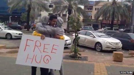 Grab from Bandr al-Swed's YouTube video showing him offering hugs in Riyadh