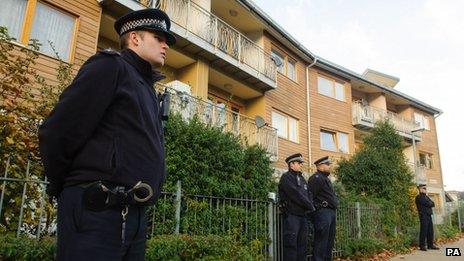Police officers patrol near flats in Brixton, south London