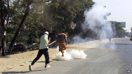 BNP activists run for cover from tear gas shells