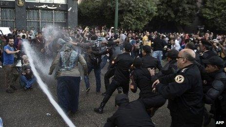 Egyptian police use a water cannon to disperse protesters in Cairo. Photo: 26 November 2013