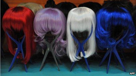 Coloured wigs on display
