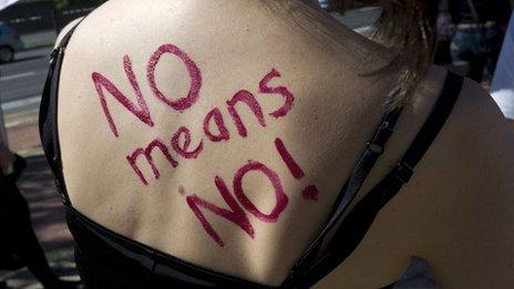 "No means no" written on the back of woman during a "slut walk" in South Africa