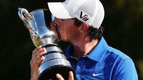 Rory McIlroy celebrates with the Australian Open trophy