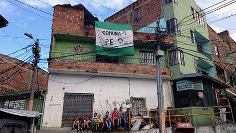 A flag marks the entrance to Barrio Pablo Escobar in Medellin, Colombia
