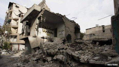 A house damaged by shelling is seen in Aleppo