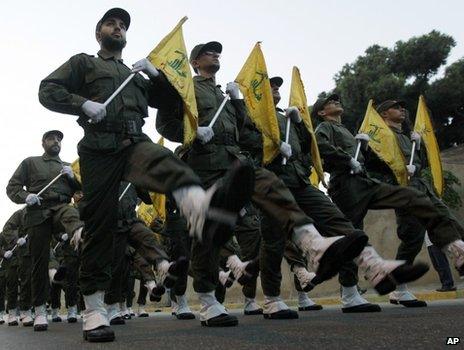 Hezbollah fighters parade through southern Beirut in 2010