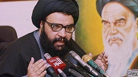Former Hezbollah secretary general Abbas al-Mousawi next to a portrait of Ayatollah Khomeini (1991)