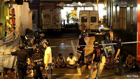 Arrested men in Little India. 8 Dec 2013