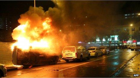 A police car on fire in Little India on 8 December 2013