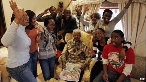 Former South African President Nelson Mandela celebrates his 90th birthday surrounded by his grandchildren during an interview with the media at his house in Qunu, on July 18, 2008