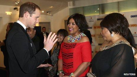Prince William, Duke of Cambridge meets Zenani (C) and Zindzi Mandela (R), daughters of former South African president Nelson Mandela, at the Royal Premiere of "Mandela: Long Walk to Freedom" in London December 5, 2013.