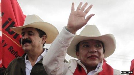 Xiomara Castro (right) and her husband Manuel Zelaya participate in a protest against the results of the presidential election in Tegucigalpa on 1 December, 2013
