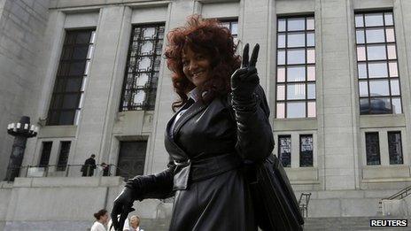Terri-Jean Bedford gestures while leaving the Supreme Court of Canada following a hearing on the country's prostitution laws, in Ottawa on 13 June 2013