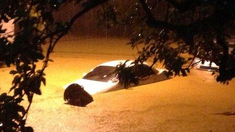 Car in floodwater in Bexon, St Lucia