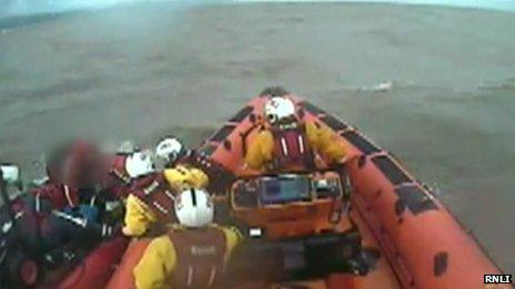 Somerset men rescued after boat carried out to sea - BBC News