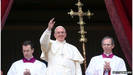 Pope Francis waves to the faithful as he delivers his Christmas Day message