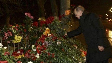 Vladimir Putin lays flowers at the site of an explosion in Volgograd, 1st Jan