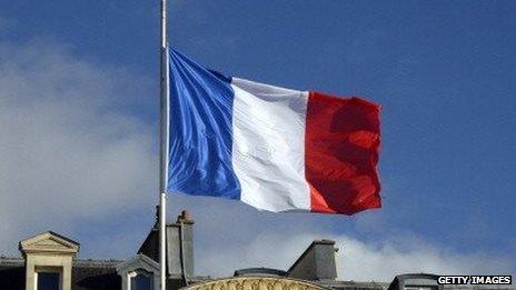 A French flag flies at half mast over the Elysee presidential palace.