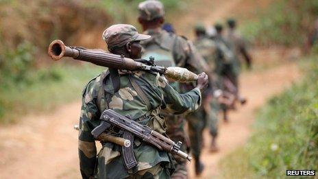 DR Congo soldiers patrol near Beni in North Kivu province on 31 December 2013