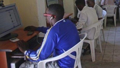 People use computers at an internet cafe in the Hodan area of Mogadishu, 9 October 2013