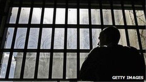 Prisoner looking out of cell window