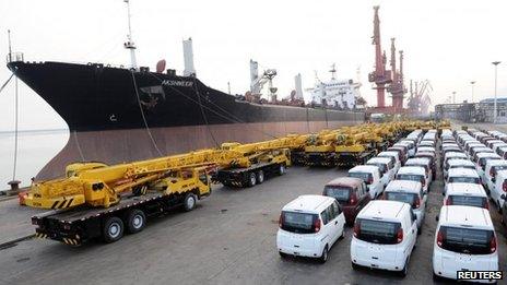 Vans and cranes are parked in a port in Lianyungang, Jiangsu province