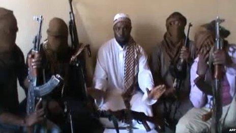 A screen grab allegedly showing Boko Haram leader Abubakar Shekau (C) flanked by militants
