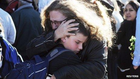 Students are reunited with family following a shooting at Berrendo Middle School 14 January 2014