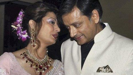 Shashi Tharoor listens to his wife Sunanda Pushkar at their wedding reception in Delhi, September 2010