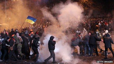 Protesters clash with riot police during an opposition rally in the centre of Kiev