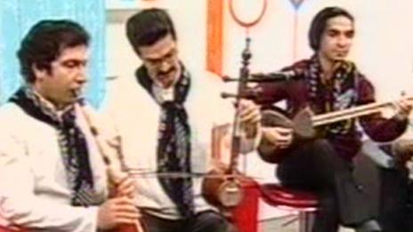 A group of musicians and their instruments on Iranian TV