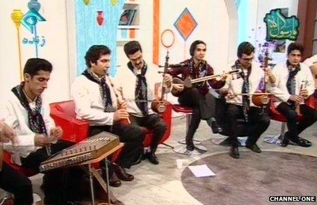 A group of musicians and their instruments on Iranian TV
