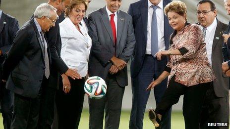 Dilma Rousseff kicks a ball at Arena das Dunas, Natal, Brazil on 22 January 2014