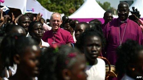 Archbishop of Canterbury Justin Welby (C) visits the ECS All Saints church in Juba, South Sudan on January 30, 2014.