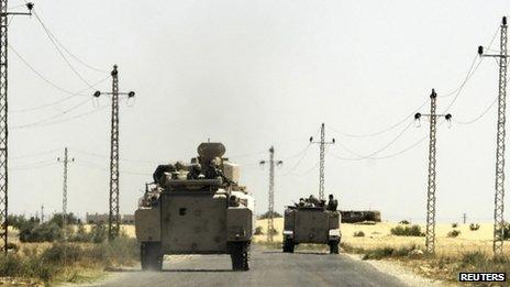 Soldiers in military vehicles travel towards al-Jura district in El-Arish city from Sheikh Zuwaid in the Sinai peninsula in Egypt on 21 May 2013