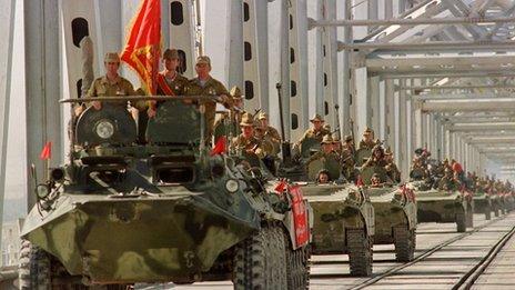 A column of Soviet armoured vehicles crossing Hairaton bridge as the pull out