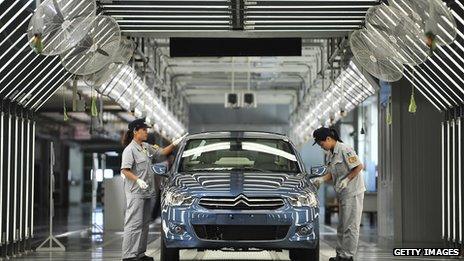 Workers on the production line in a new plant of Dongfeng Peugeot-Citroën Automobile in China
