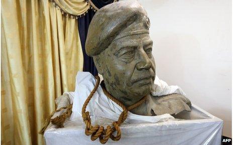The bust of former Iraqi leader Saddam Hussein and the actual rope used to hang him, on display in the living room of former national security adviser Mowaffak al-Rubaie