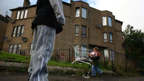 A child playing football in the Govan area of Glasgow