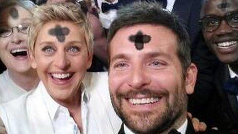 Ellen DeGeneres' and Bradley Cooper with ash crosses on their foreheads