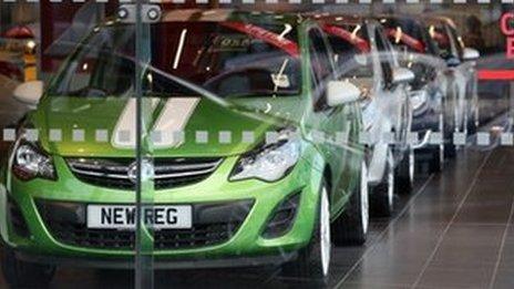 Cars are displayed for sale on the forecourt of a Vauxhall dealership on January 8, 2014 in London