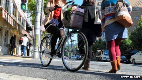 Women are seen on the street in Kyoto, Japan, on 25 October 2012